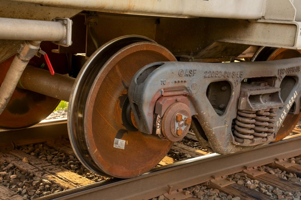 Detail view of a rusty, vintage train wheel and trucks in Reads Landing, MN.